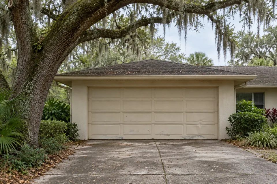 Generated illustration of an aging residential garage door ready for replacement.